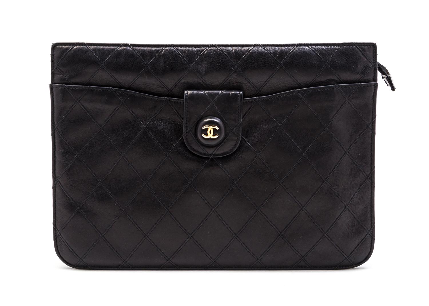 A Chanel Black Quilted Leather Clutch, 10 x 7 1/2 x 1 1/2 inches.