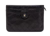 A Chanel Black Quilted Leather Clutch, 10 x 7 1/2 x 1 1/2 inches.