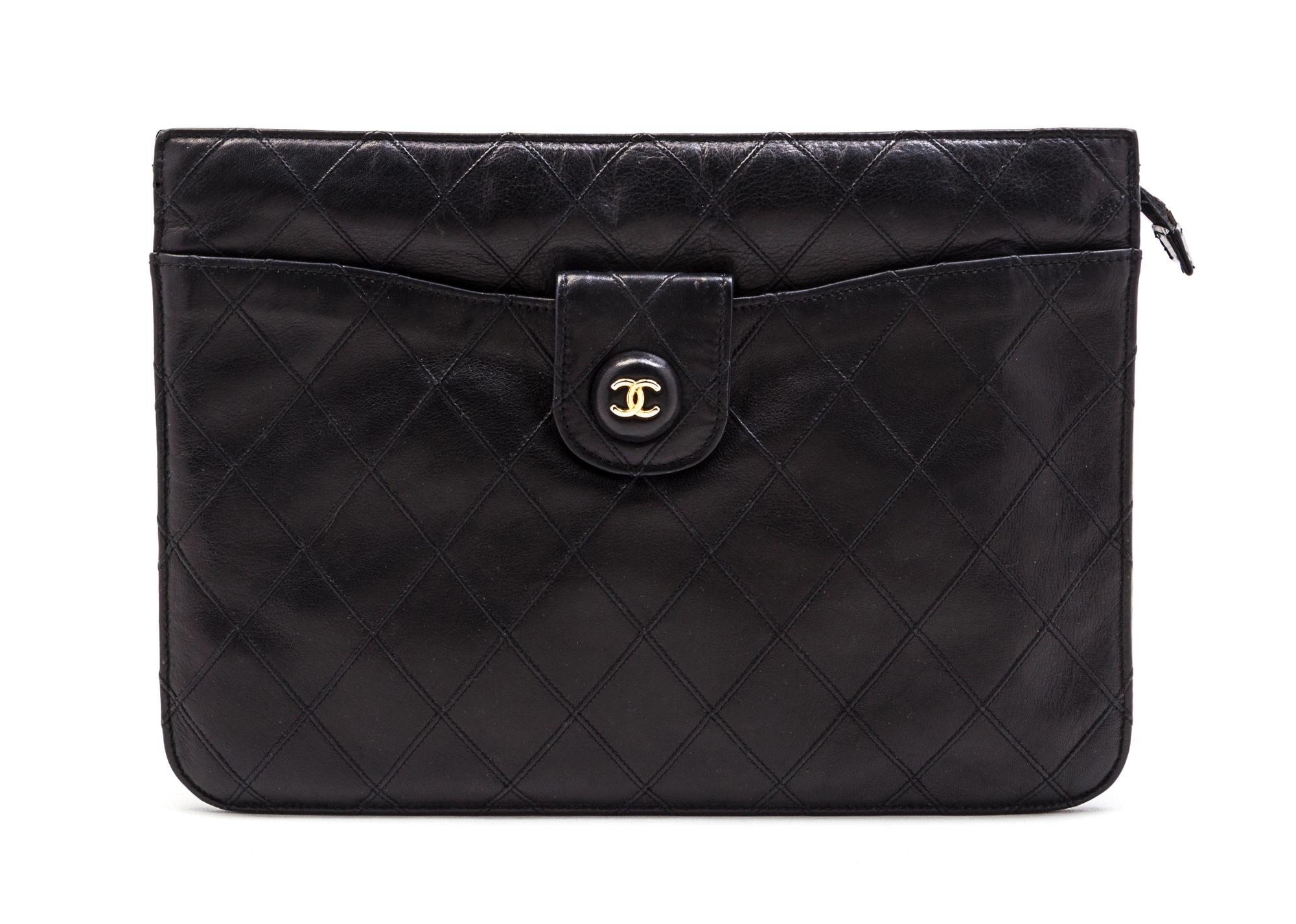 A Chanel Black Quilted Leather Clutch, 10 x 7 1/2 x 1 1/2 inches.