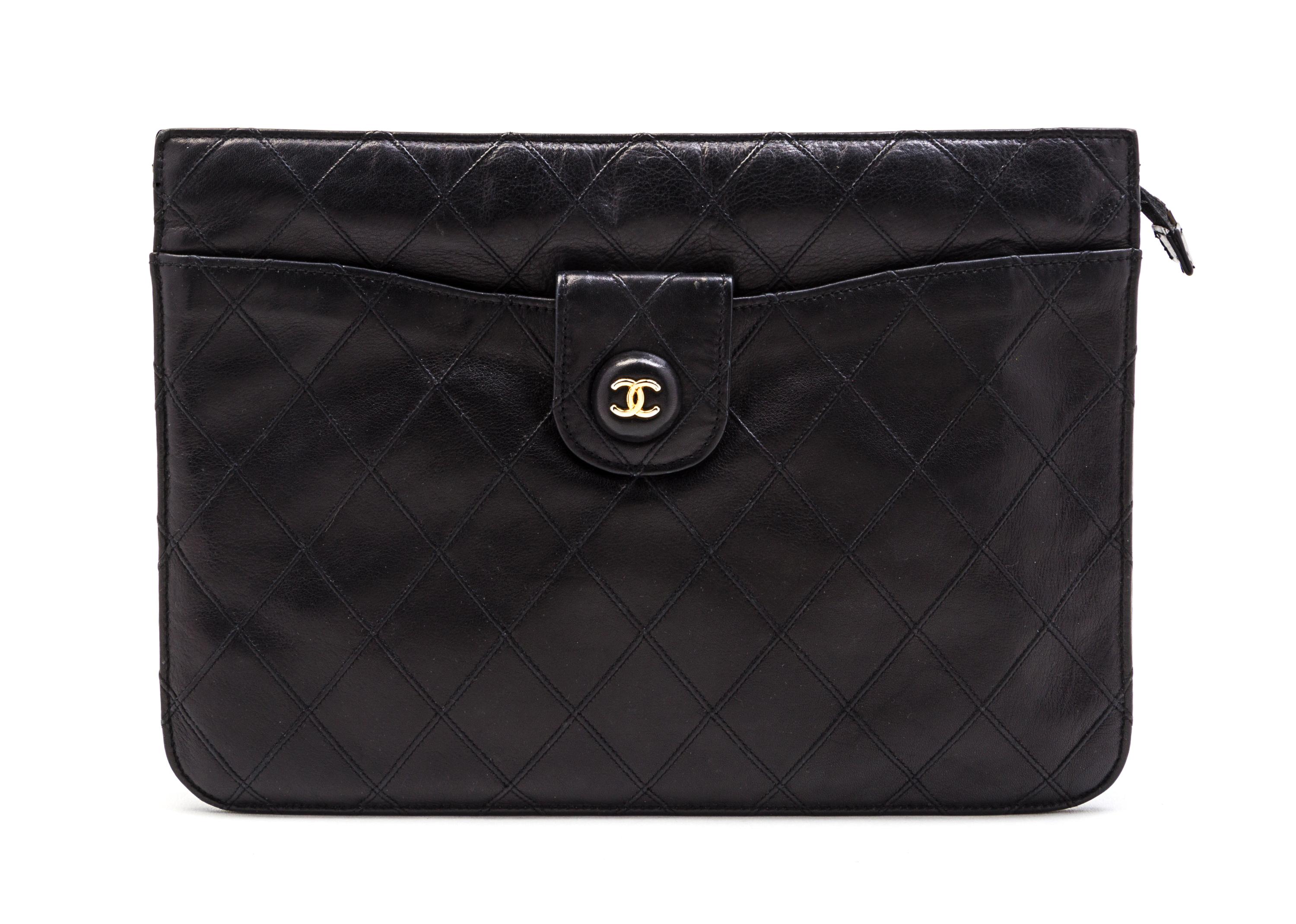 A Chanel Black Quilted Leather Clutch, 10 x 7 1/2 x 1 1/2 inches.
