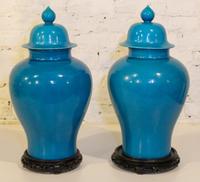 A Pair of Chinese Turquoise Glazed Porcelain Baluster Vases and Covers. Height 20 inches.