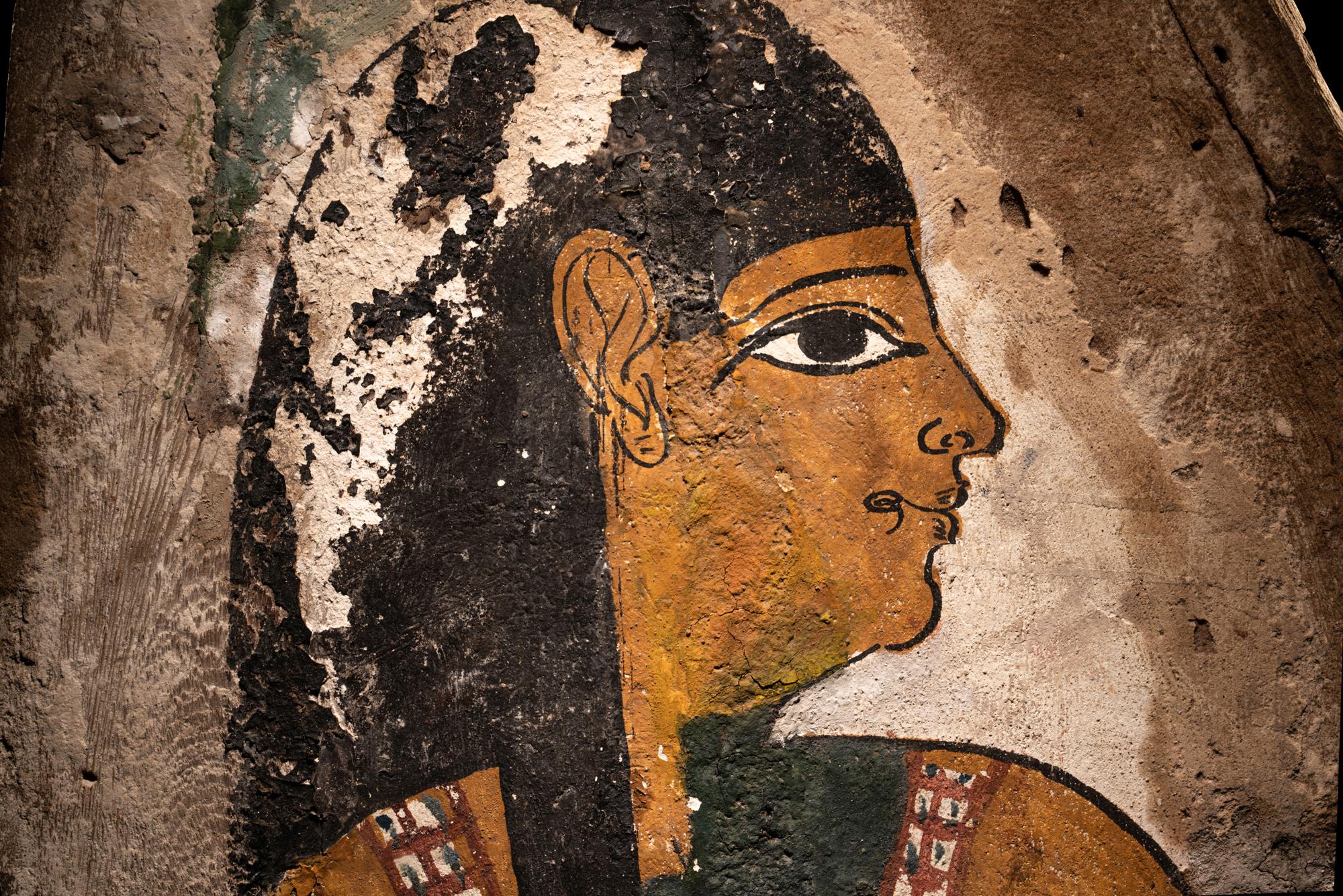 An Egyptian Polychrome Wood Fragment of a Sarcophagus with Isis