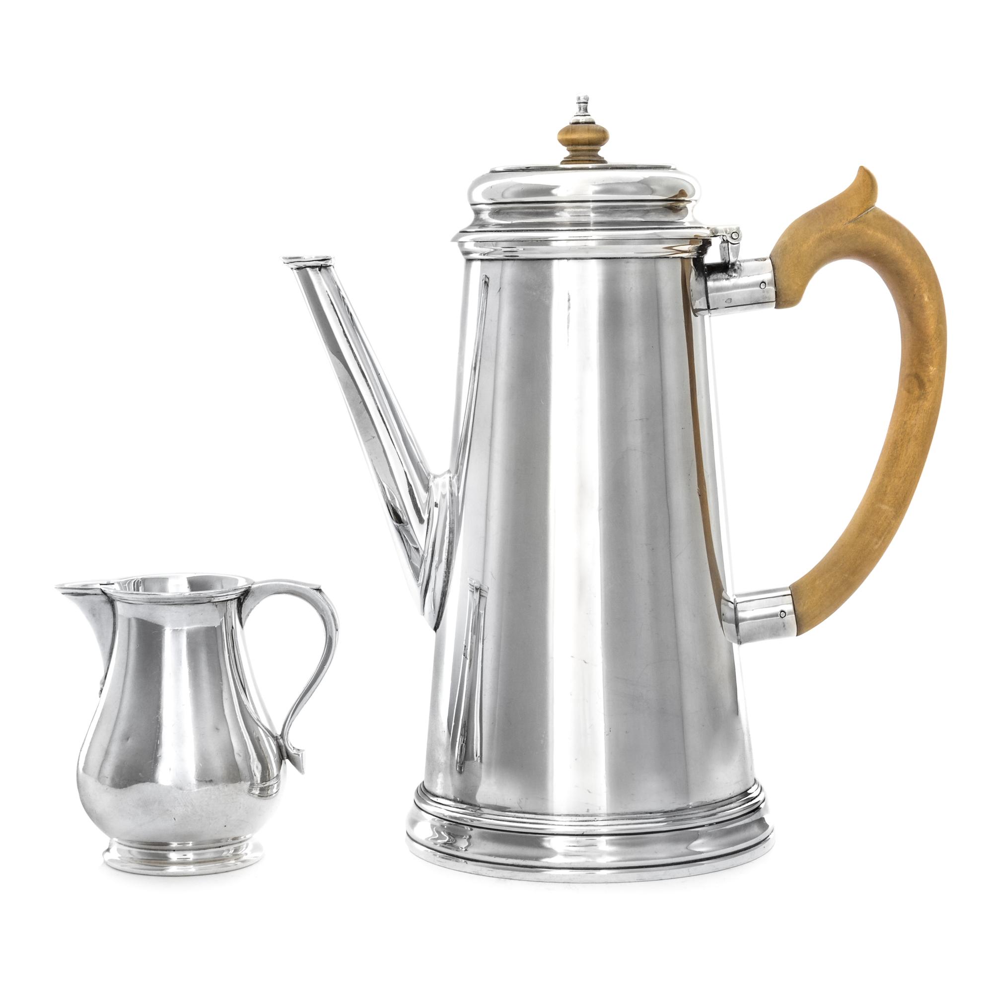 An English Silver Coffee Pot and Creamer, Walter H. Wilson Ltd., London, 1955, the coffee pot of tapering cylindrical form, the creamer