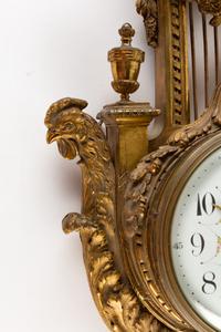 A Louis XVI Style Gilt Bronze Cartel Clock