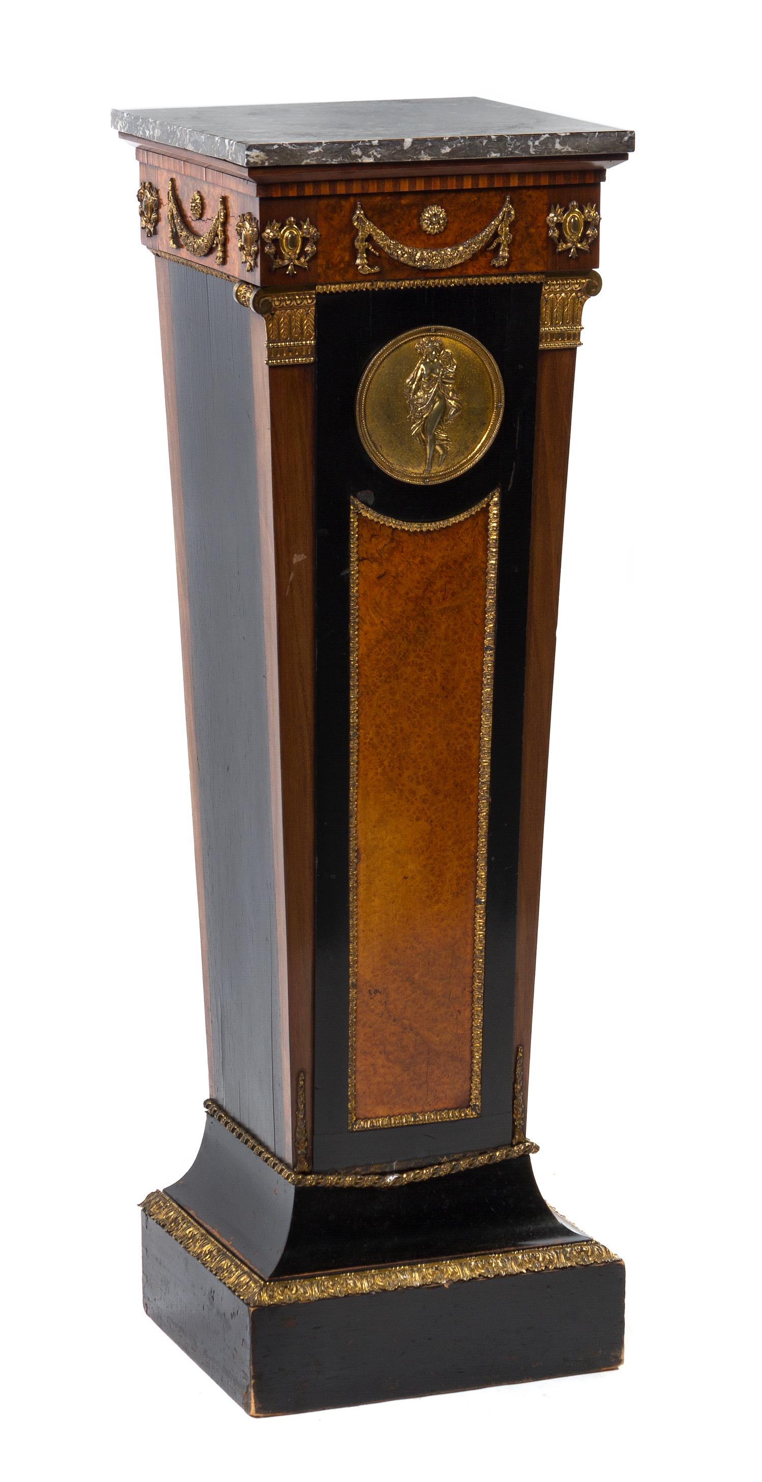 A Continental Neoclassical Gilt Metal Mounted Burl Walnut and Ebony Pedestal, Height 44 1/2 x width 14 x depth 14 inches.
