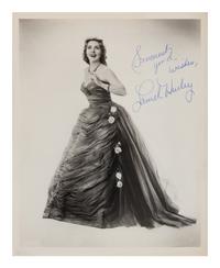 [20TH-CENTURY OPERA SINGERS]. A group of 6 signed photographs or photographic postcards of opera singers from the 1950s-1960s, comprising images of: