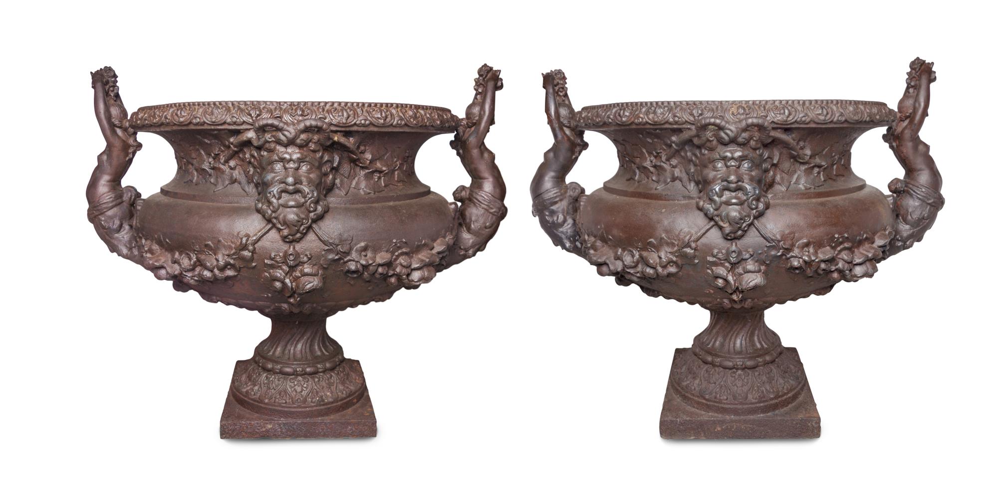 A Pair of Victorian Style Cast Iron Urns Height 35 inches. — 20TH CENTURY