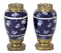 A Pair of Japanese Blue and White Hawthorne Pattern Porcelain Vases Height 16 inches.