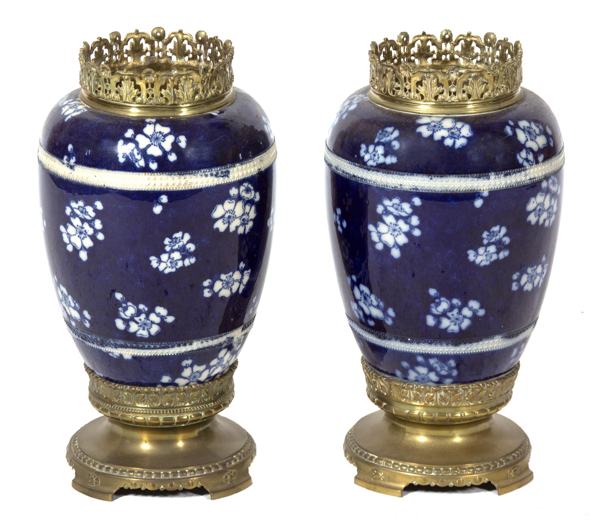 A Pair of Japanese Blue and White Hawthorne Pattern Porcelain Vases Height 16 inches.