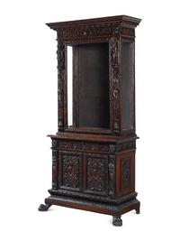 An Austrian Carved Walnut Cabinet