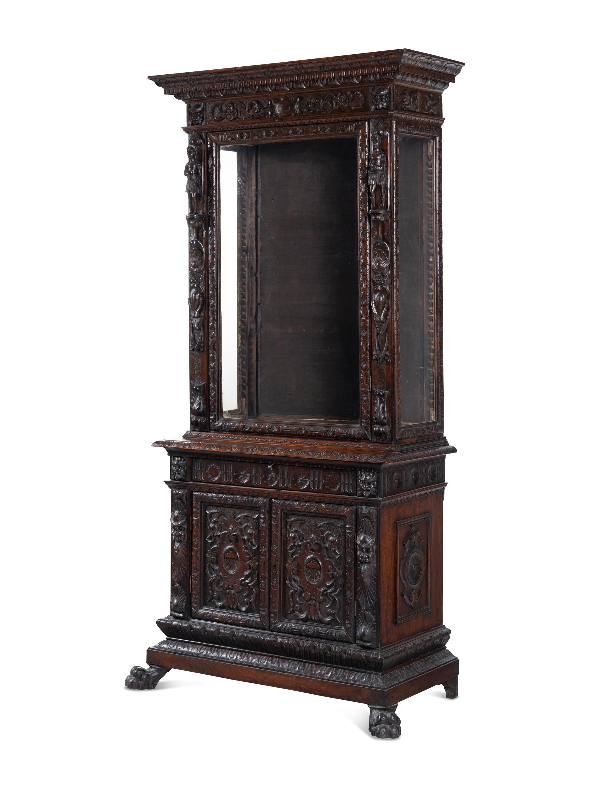 An Austrian Carved Walnut Cabinet