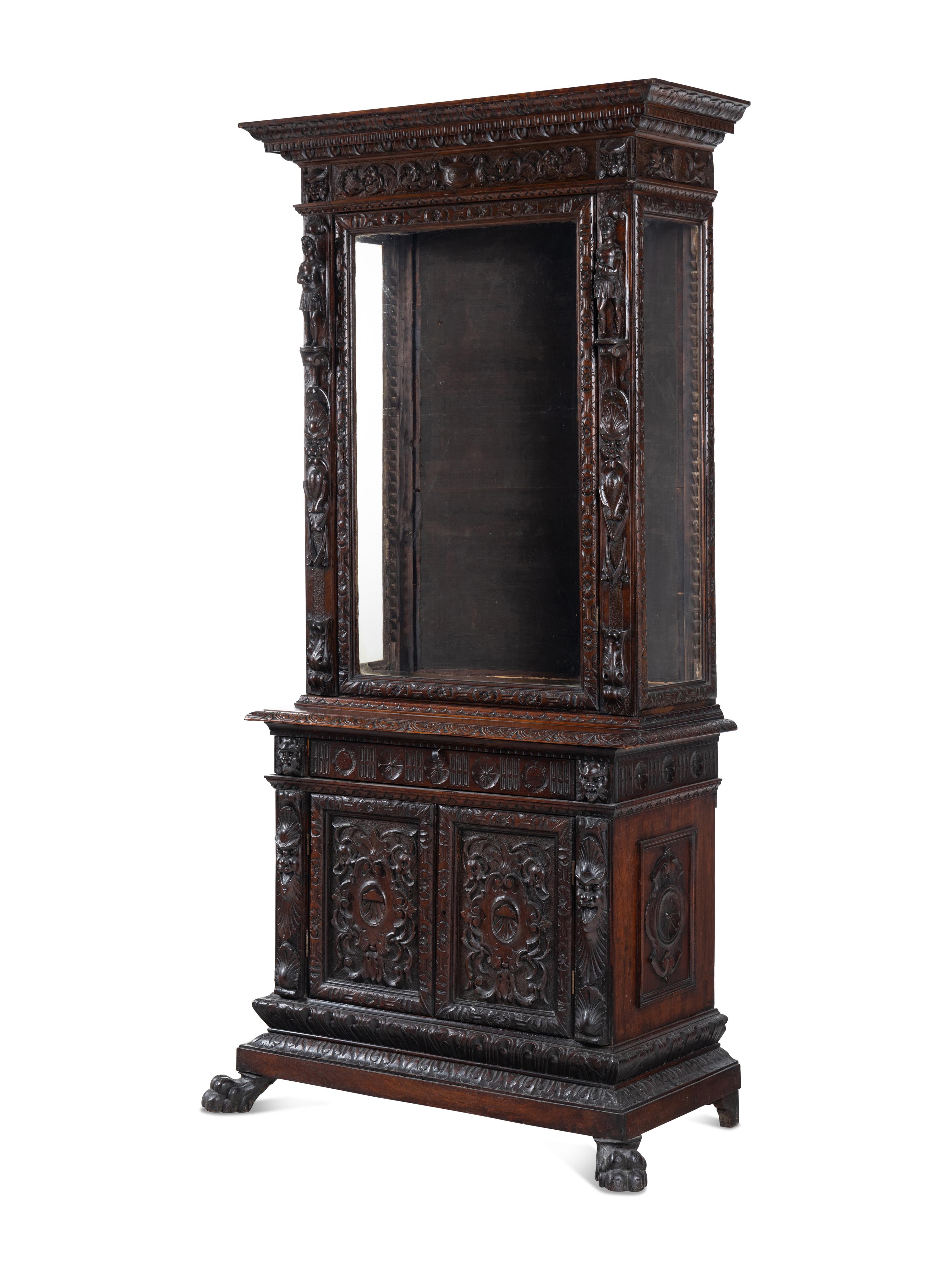 An Austrian Carved Walnut Cabinet