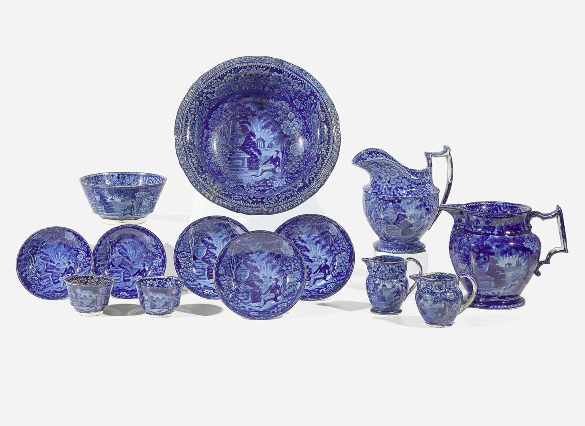A group of thirteen "Lafayette at the Tomb of Franklin" Staffordshire Historical Blue tablewares; England, first third 19th century