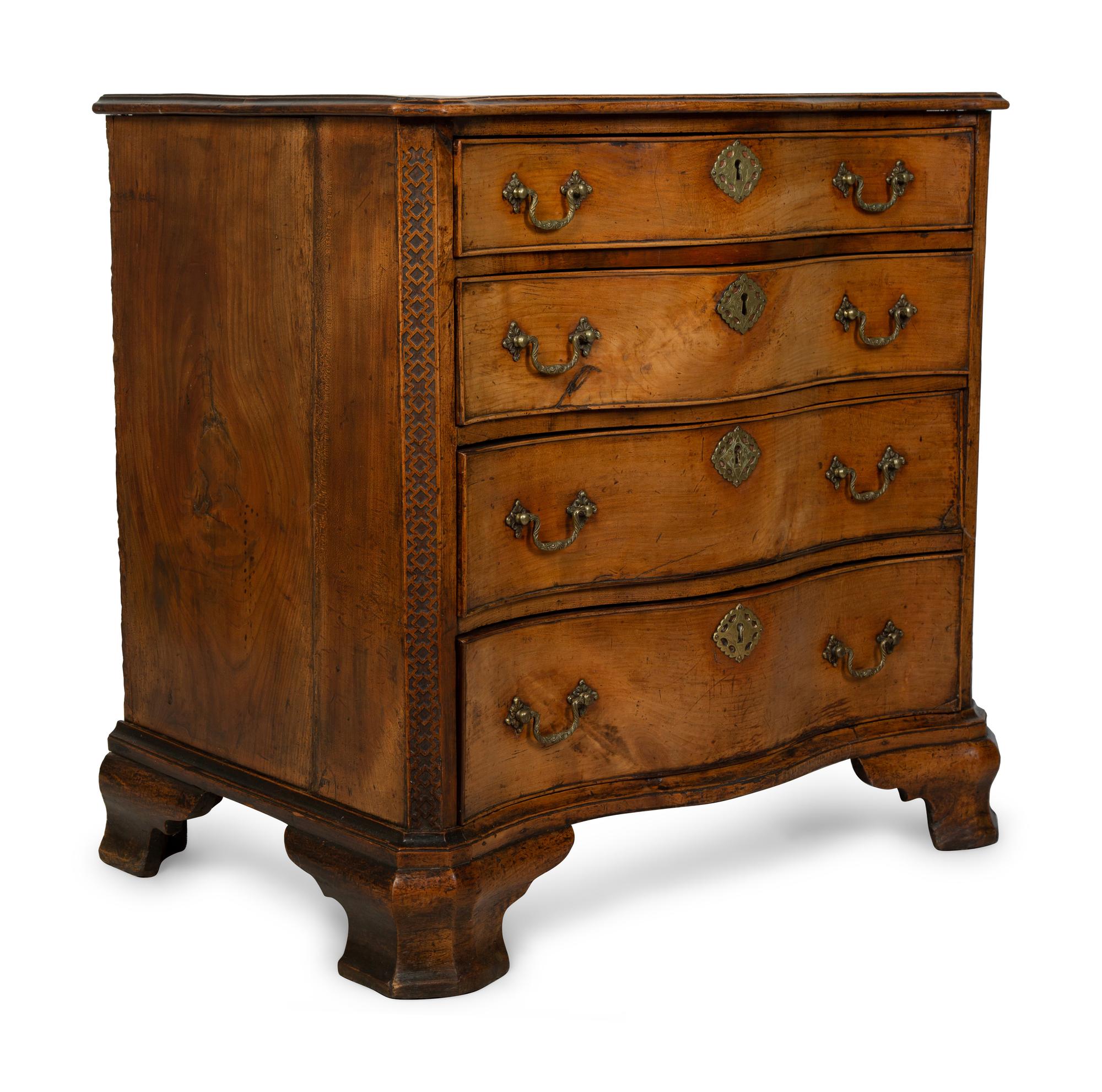 A George III Walnut Serpentine Chest of Drawers — 18TH CENTURY