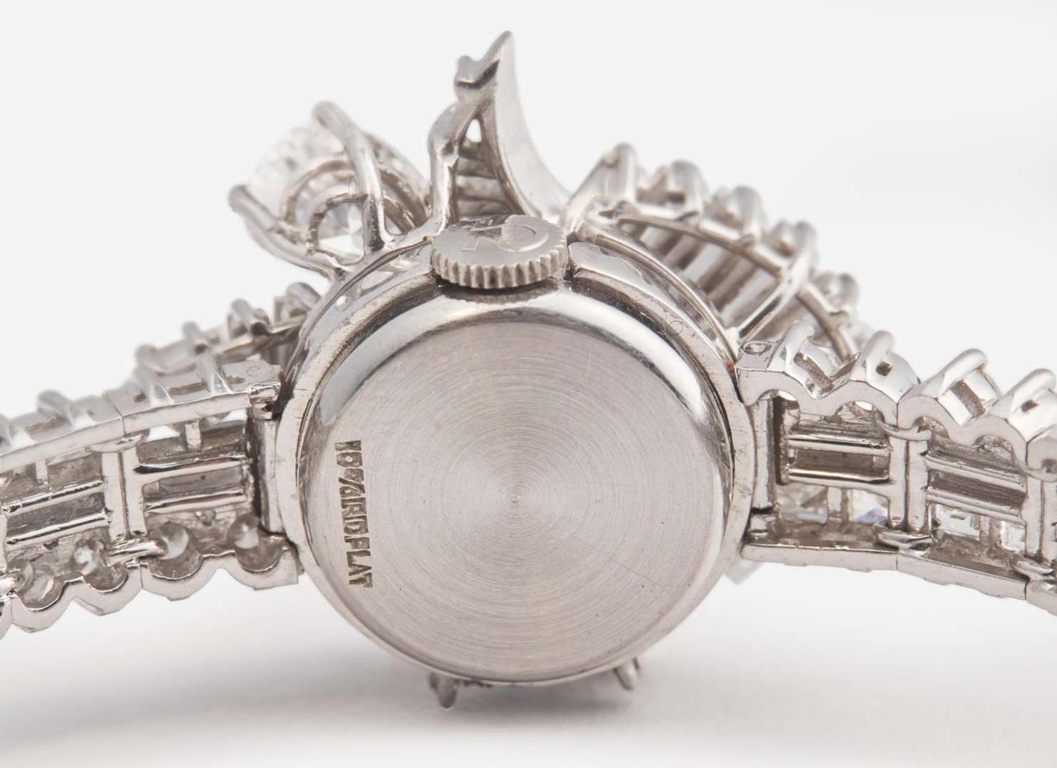 A Ladies Hidden Dial Platinum and Diamond Omega Watch