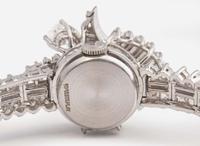 A Ladies Hidden Dial Platinum and Diamond Omega Watch