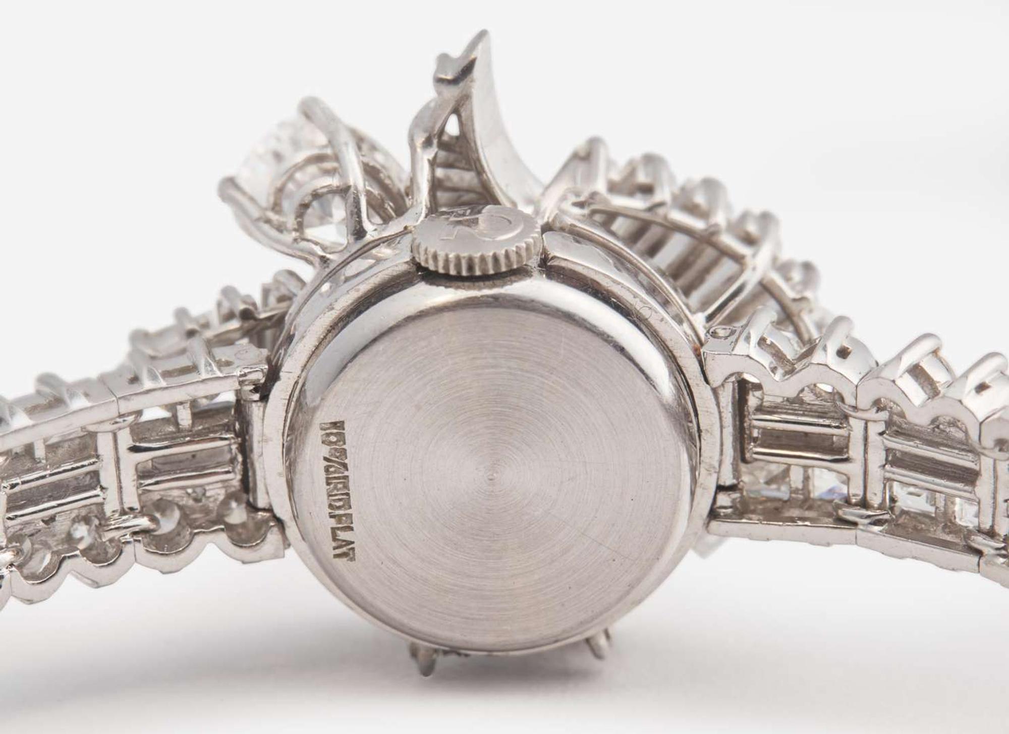 A Ladies Hidden Dial Platinum and Diamond Omega Watch