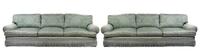 A Pair of Silk Damask Upholstered Three-Seat Sofas Width 120 inches.