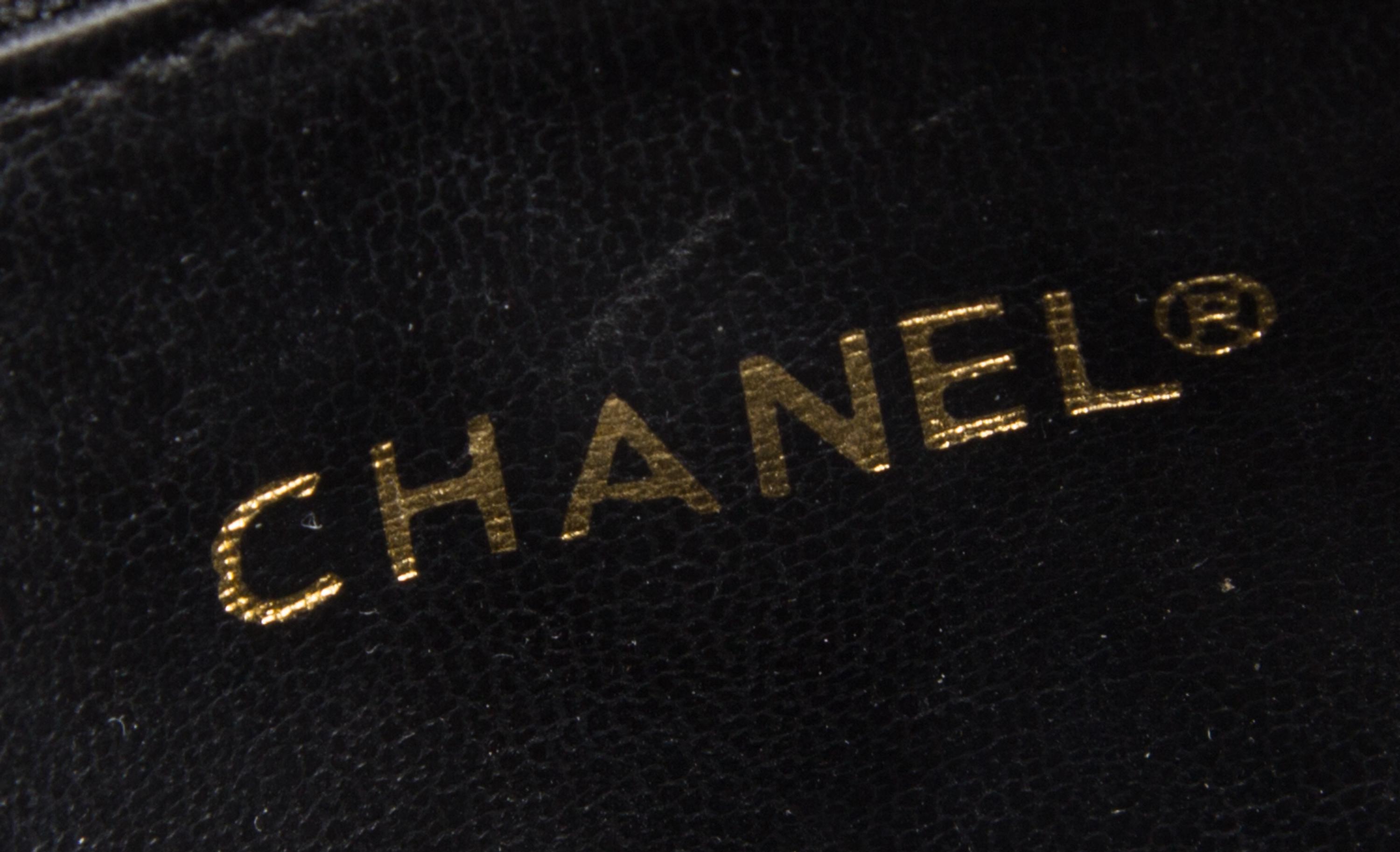 A Chanel White Leather Quilted Handbag, 10.5" x 8".