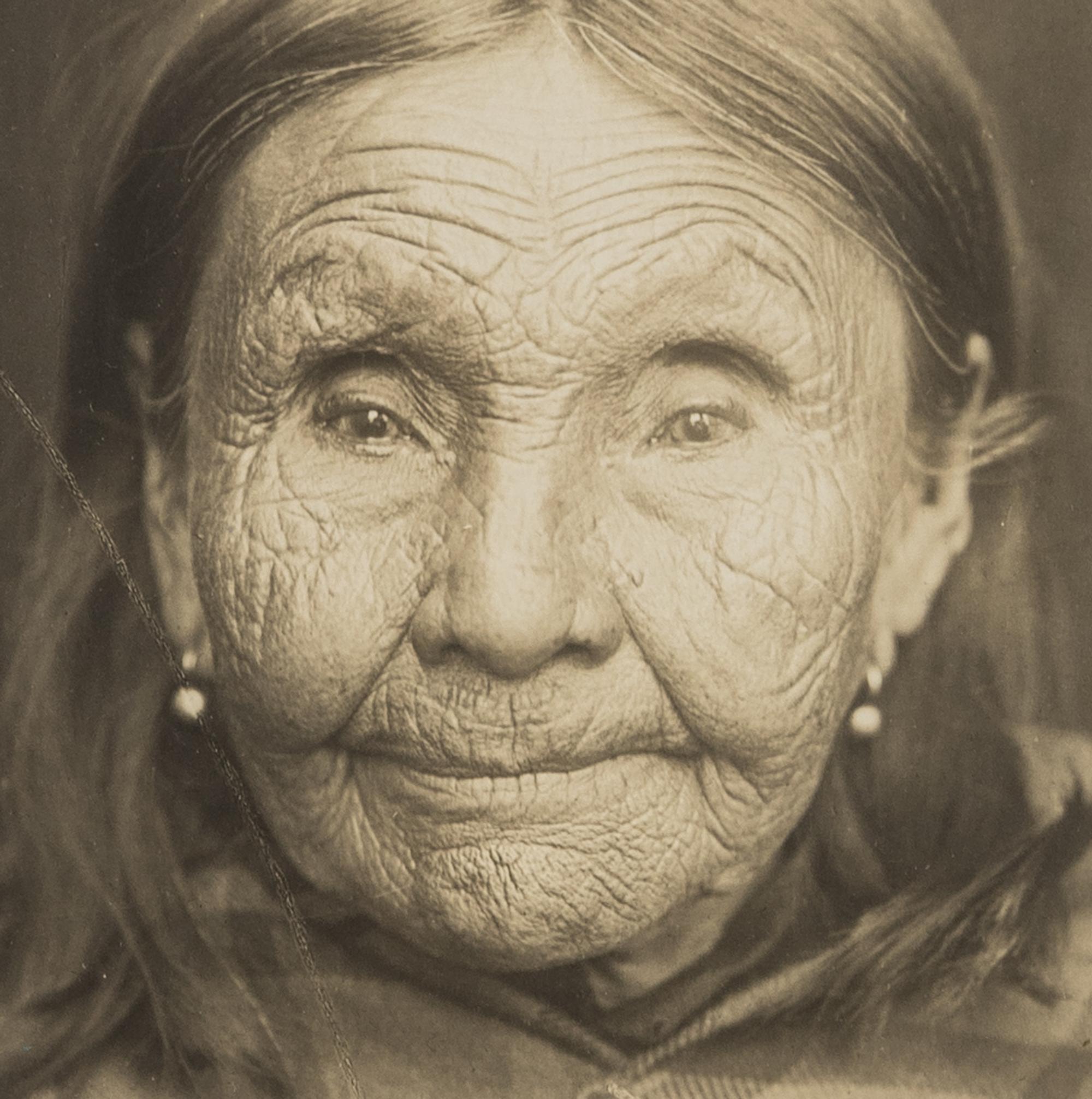 Edward S. Curtis (1868-1952) Untitled portrait (Native American Woman in Plaid Shawl,) c. 1900