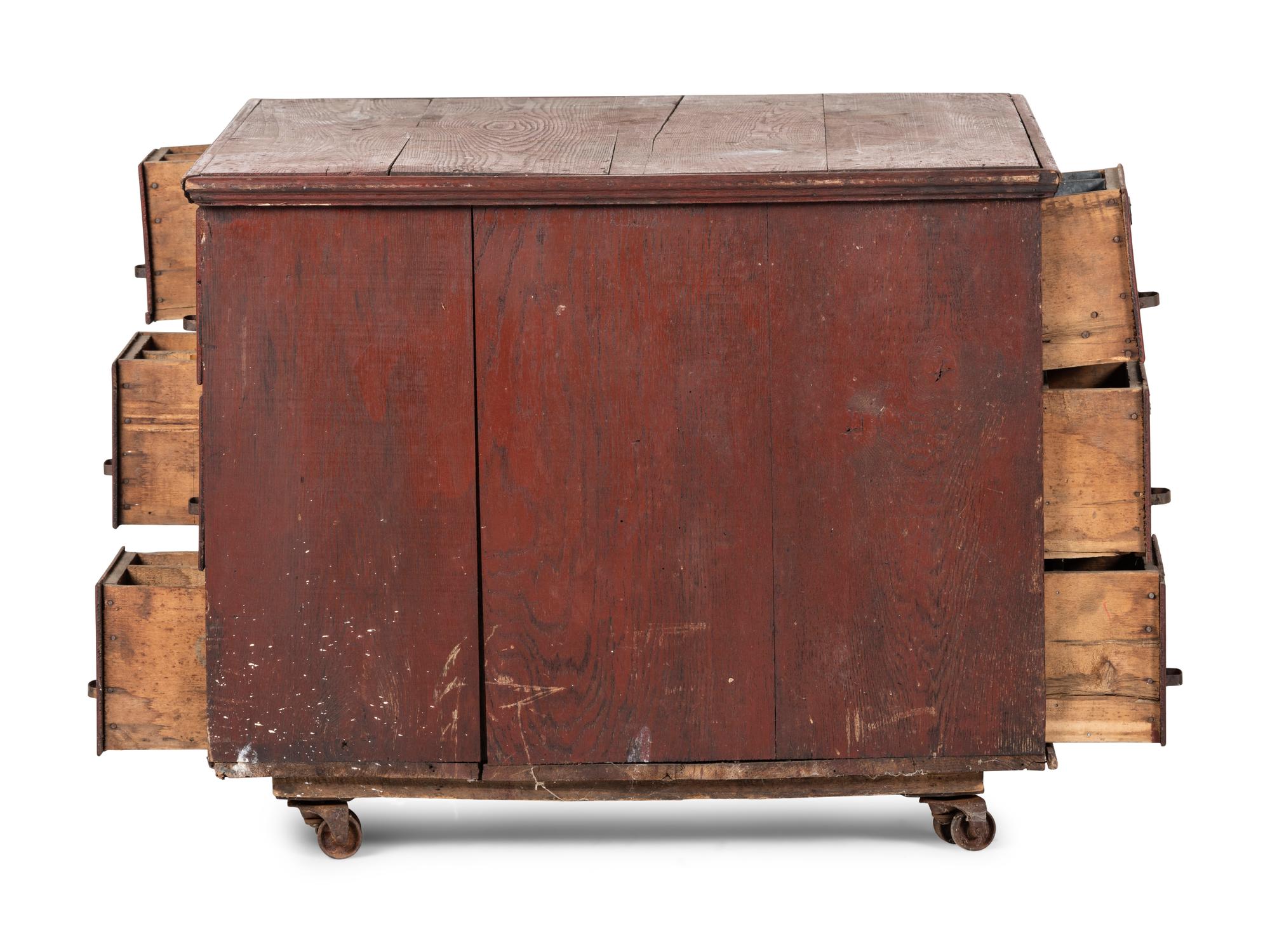 A Red Painted Pine Storage Chest on Casters