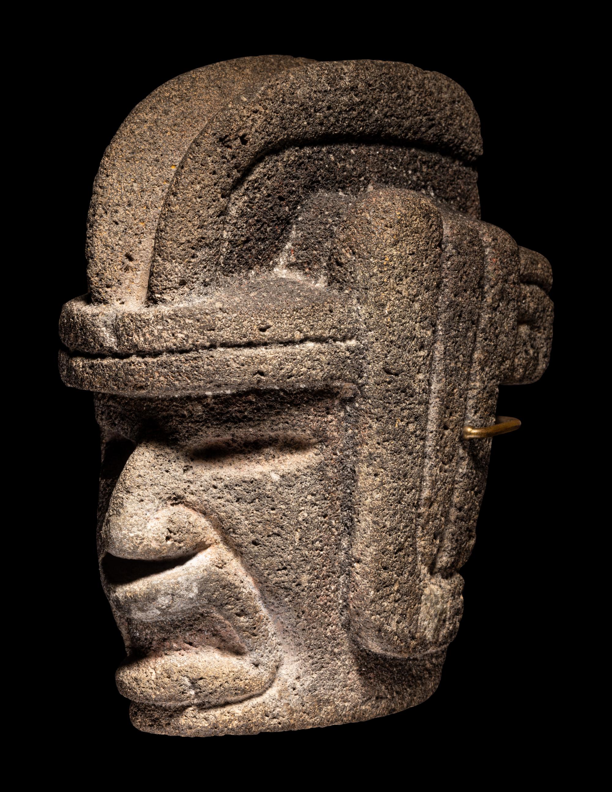 A Veracruz Stone Hacha in the Form of a Warrior