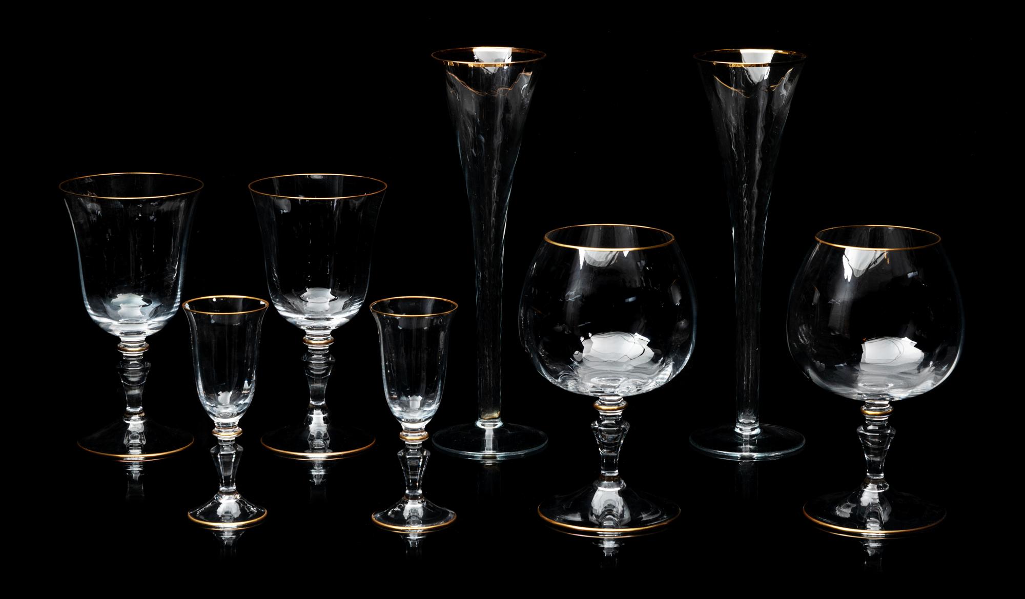 Italian Murano Fifty-Seven Piece Stemware Set With Gilt Rims Height of tallest glass 9 3/4 inches.