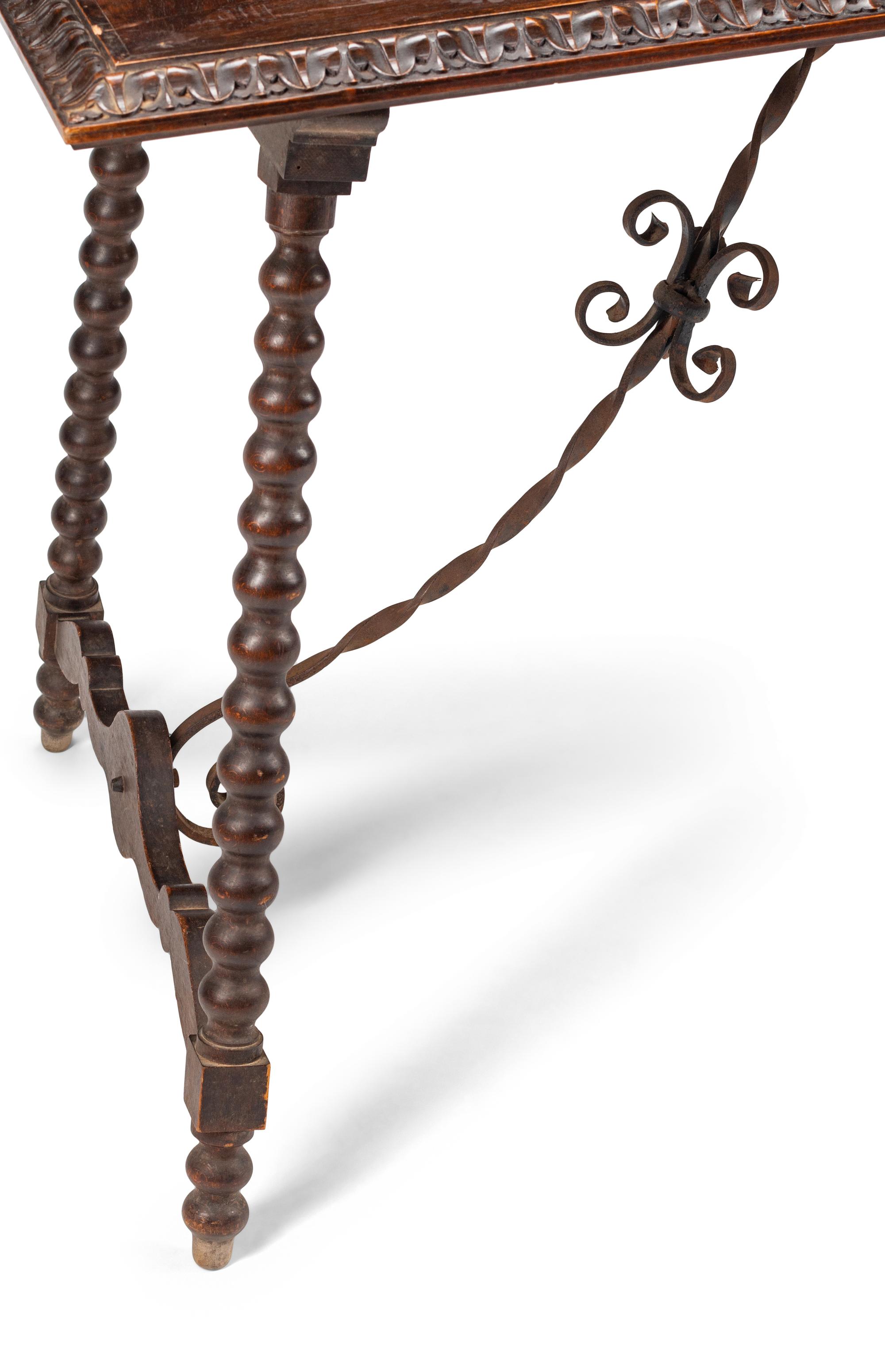 A Renaissance Style Iron Mounted Walnut Table
