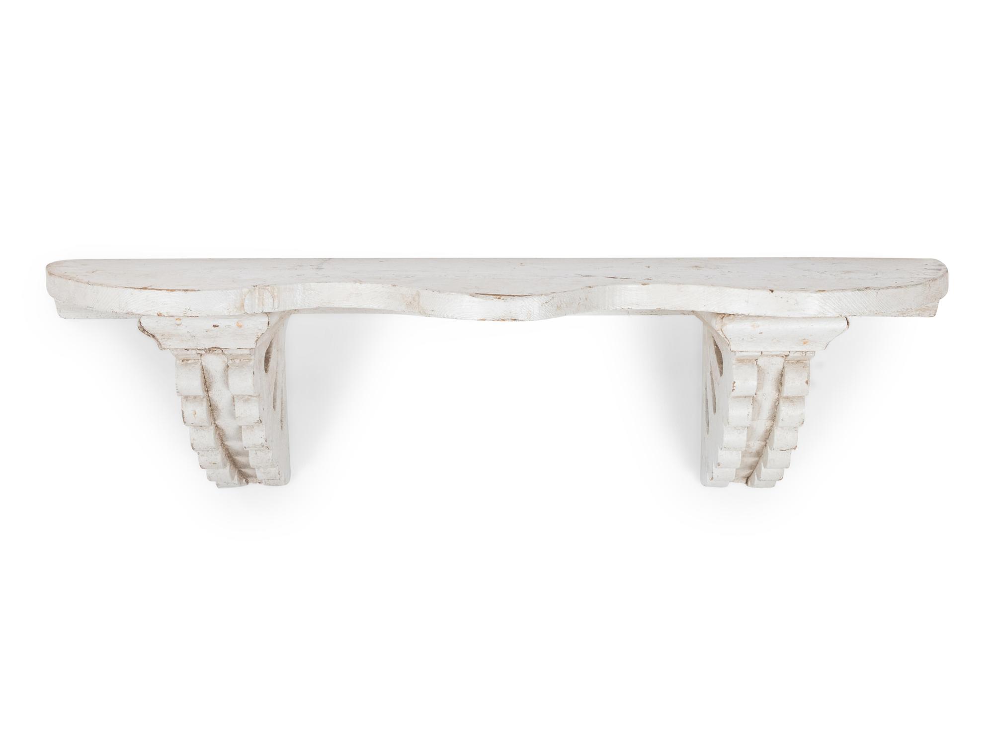 A Victorian Carved and White-Painted Pine Wall Shelf