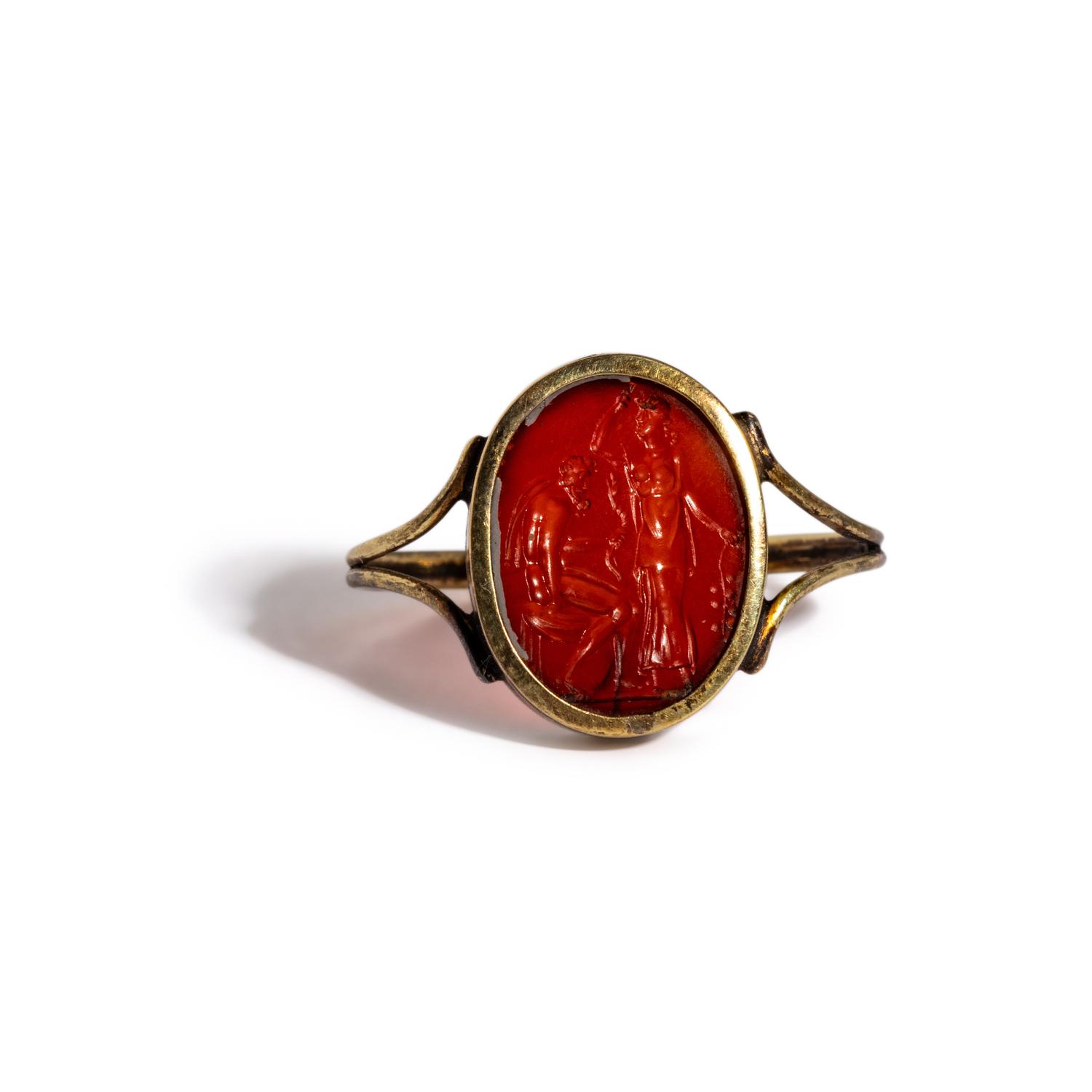 A Neoclassical Carnelian and Gold Finger Ring with a Laurel Branch Offering