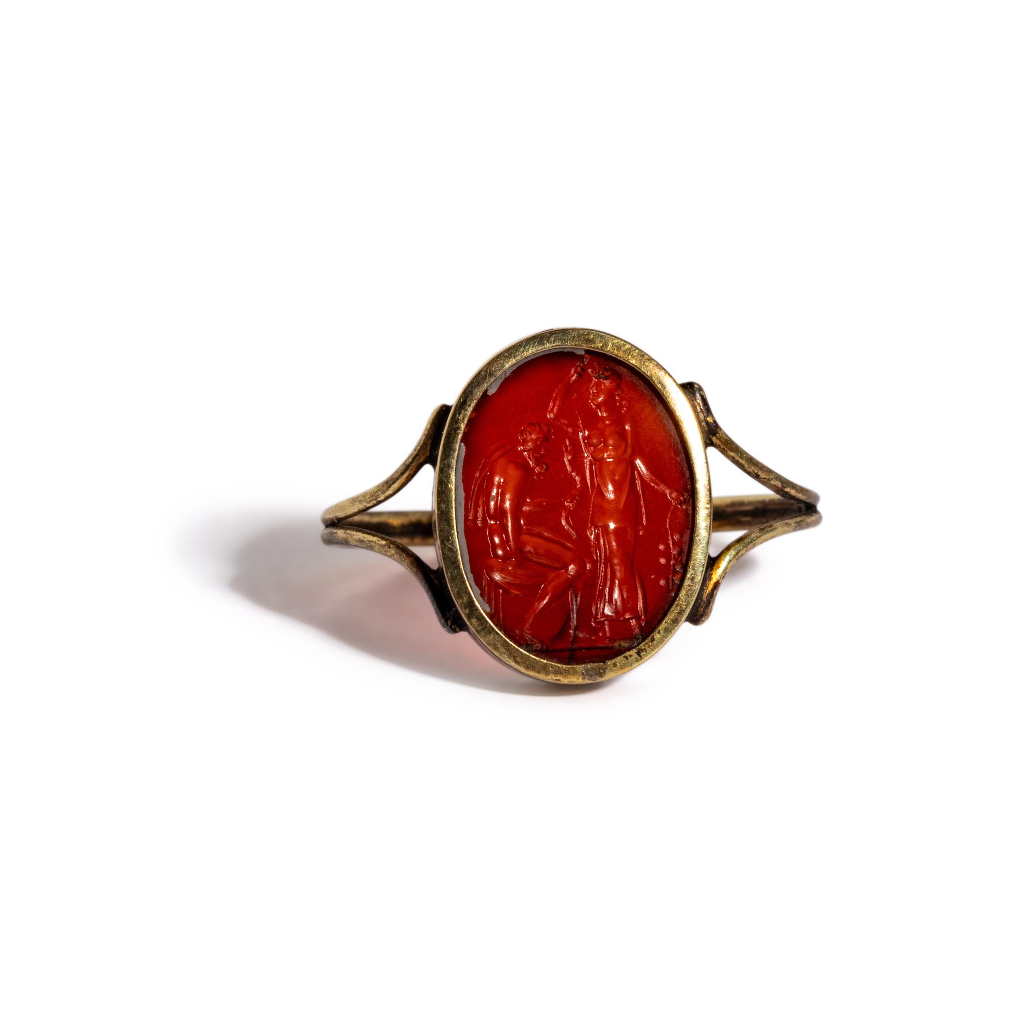 A Neoclassical Carnelian and Gold Finger Ring with a Laurel Branch Offering