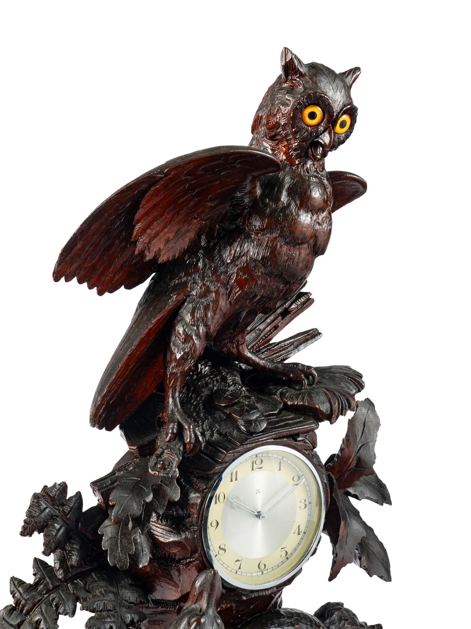 A Swiss "Black Forest" Carved Wood Clock