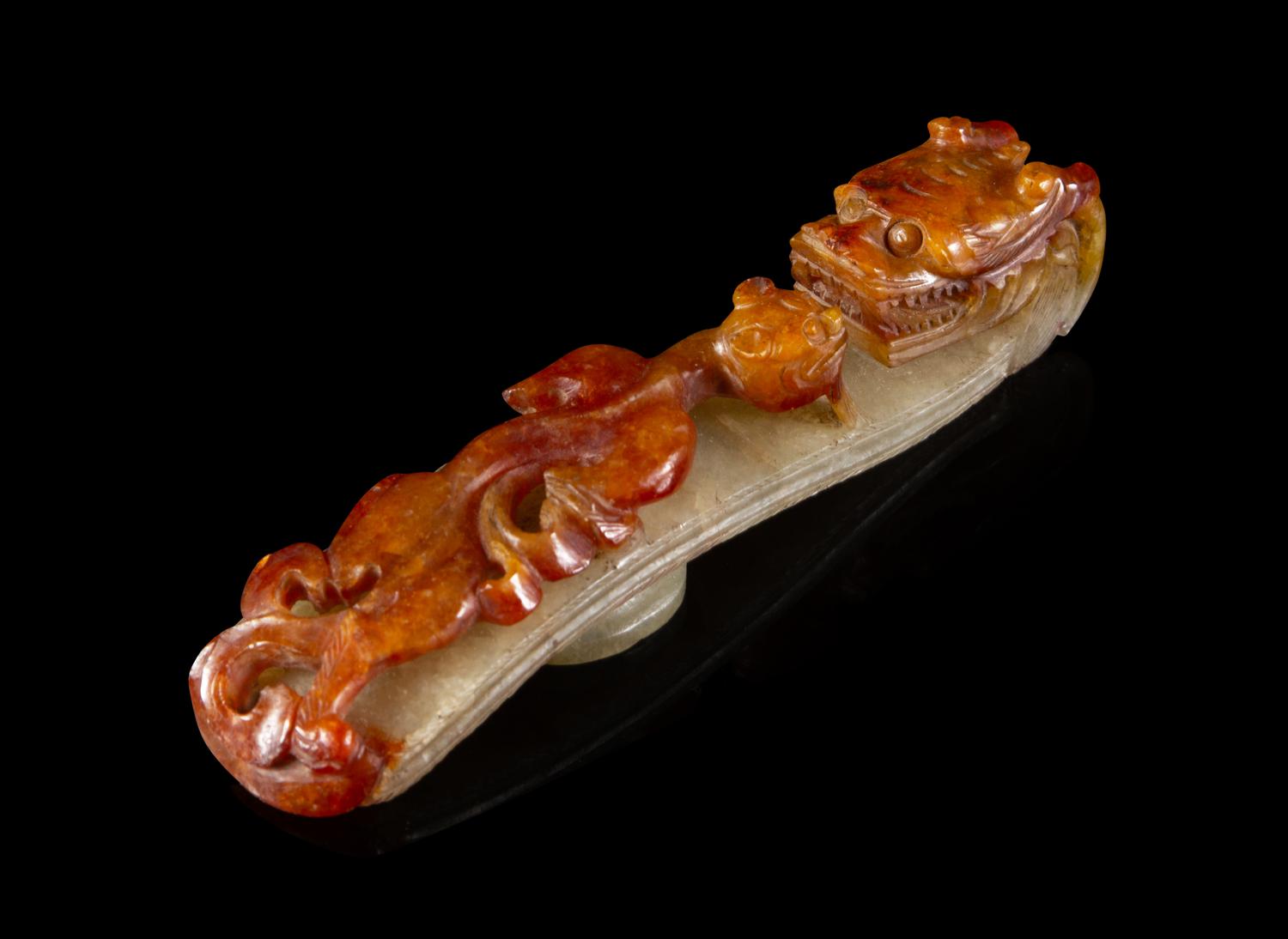 A Chinese Russet and Celadon Jadeite Belt Hook