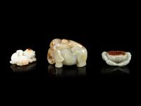 Three Jade Celadon and Russet Figures