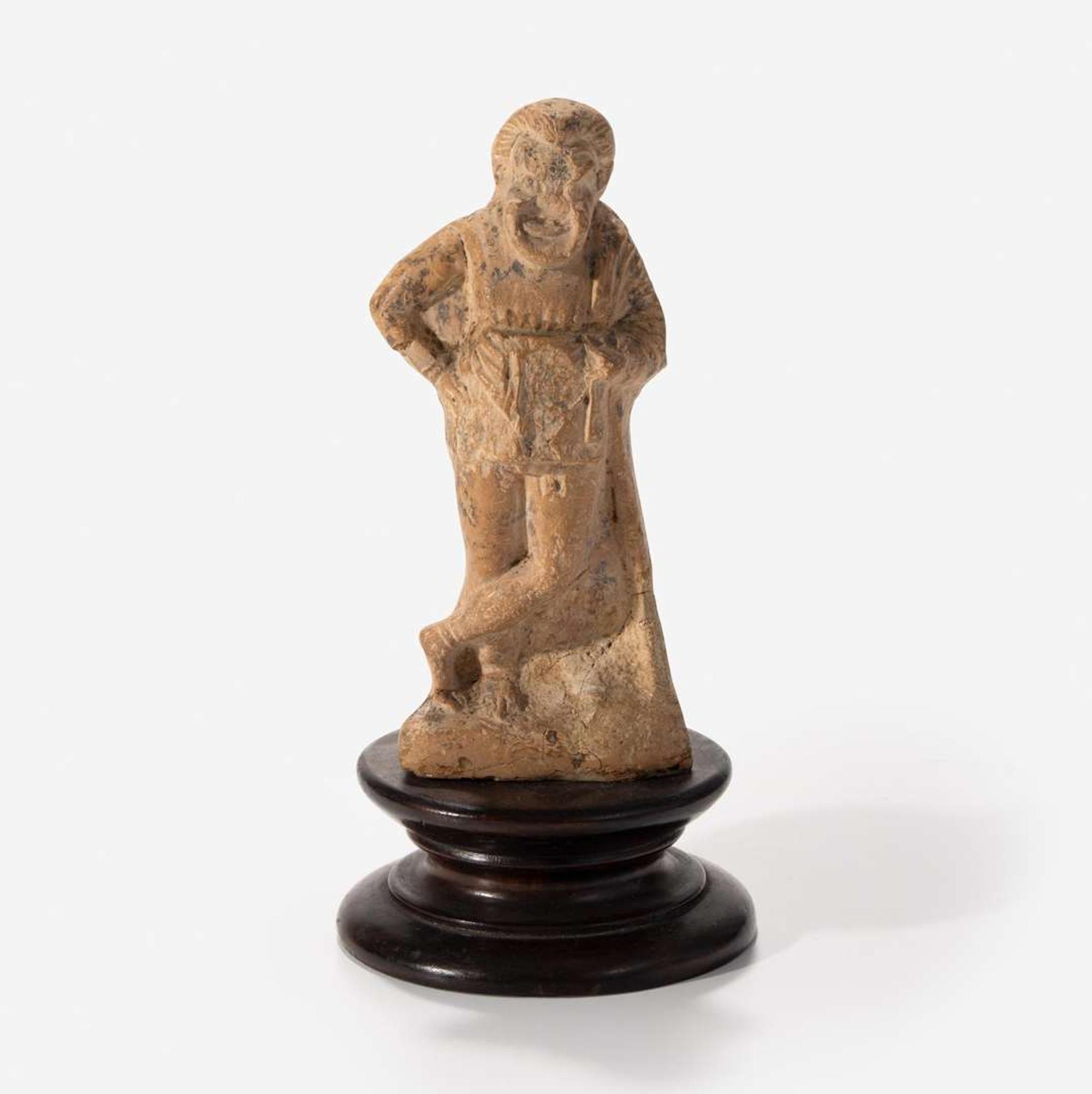 An Ancient Greek Terracotta Figurine of a Comic Actor Attica, c. 350 B.C.