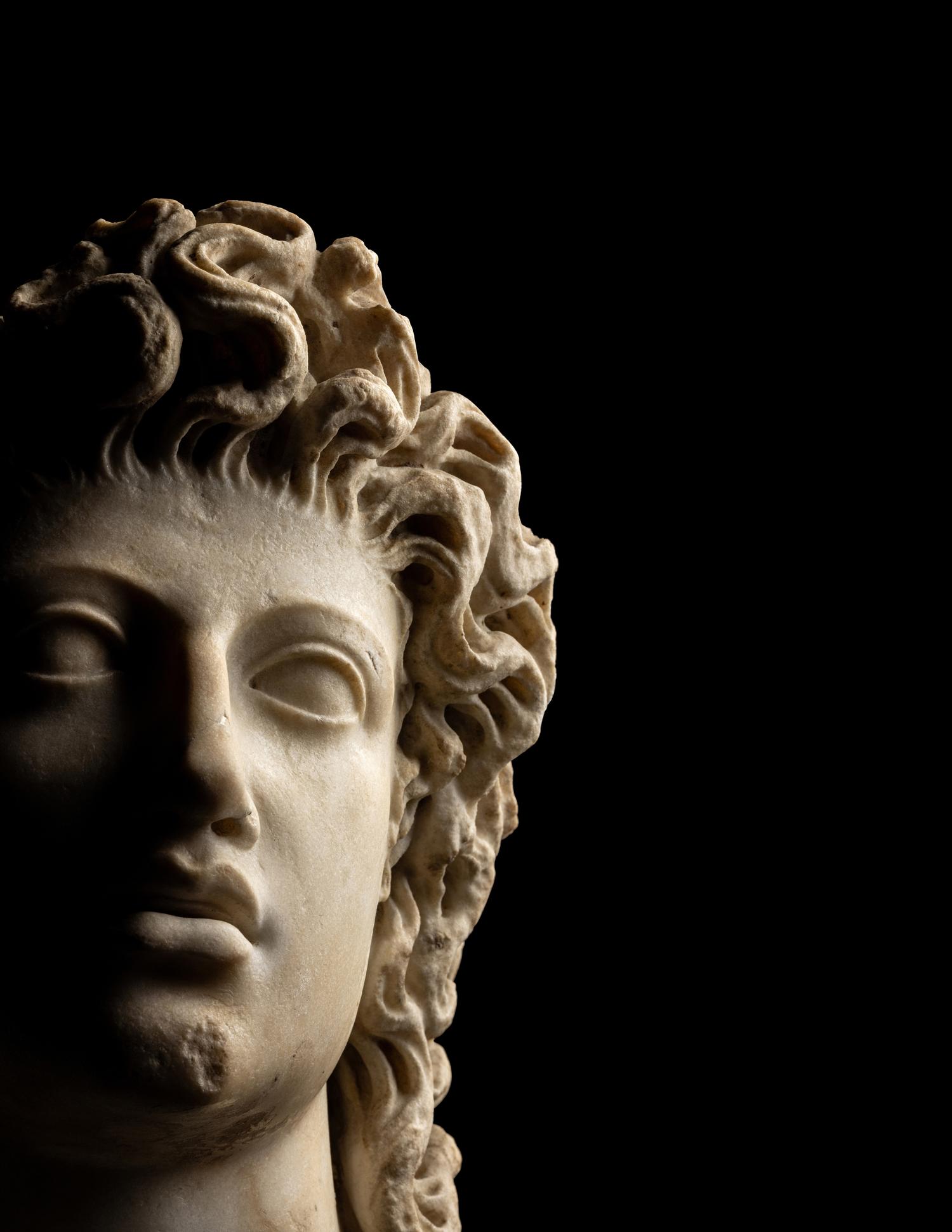 A Roman Marble Head of a Triton
