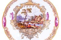 Three Meissen Painted and Parcel Gilt Porcelain Cup and Saucer Sets, a Covered Cup and Two Spoons