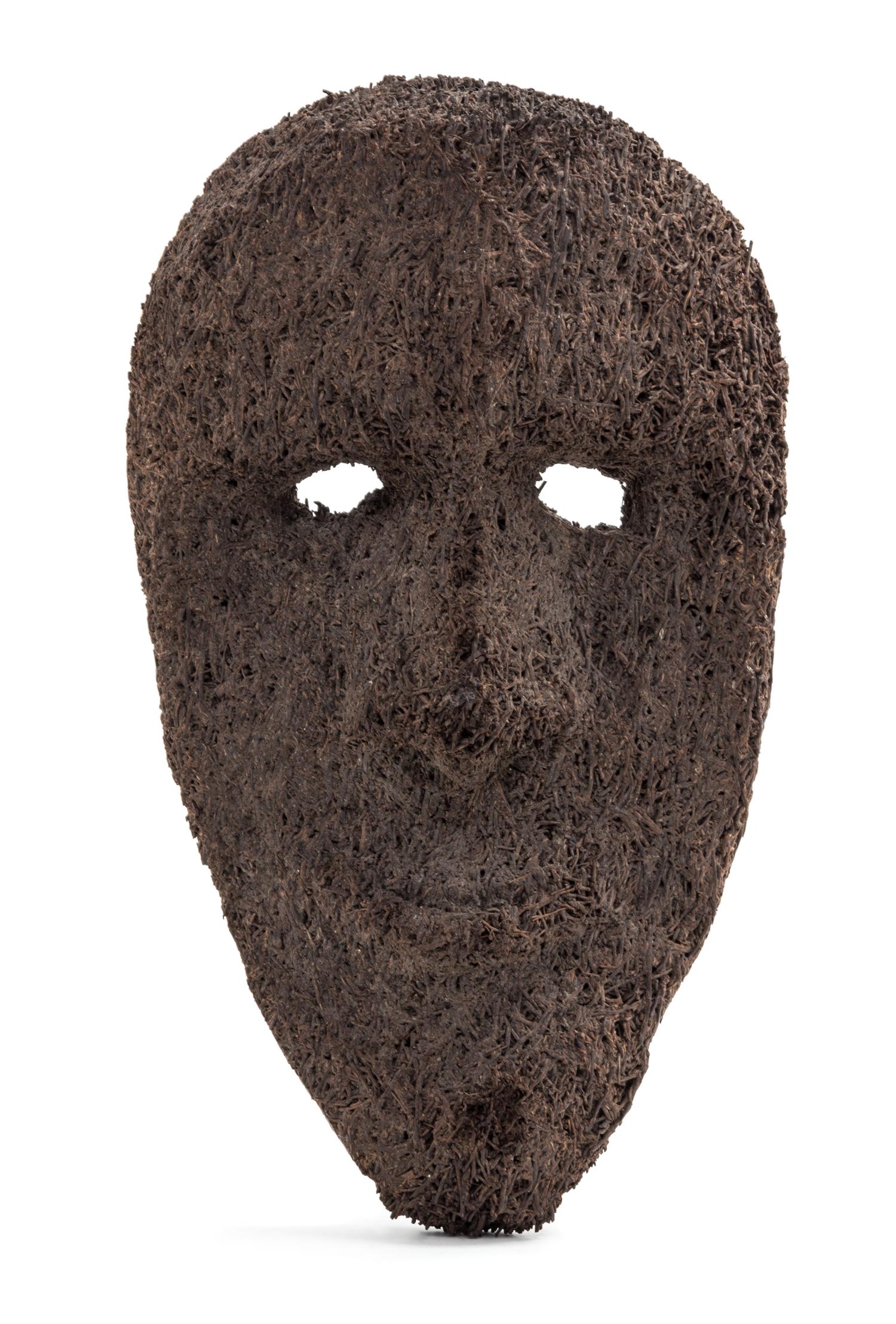 A Sepik River Fernwood Masque, Papua, New Guinea. Height 11 x width 6 3/4 x depth 2 3/4 inches.