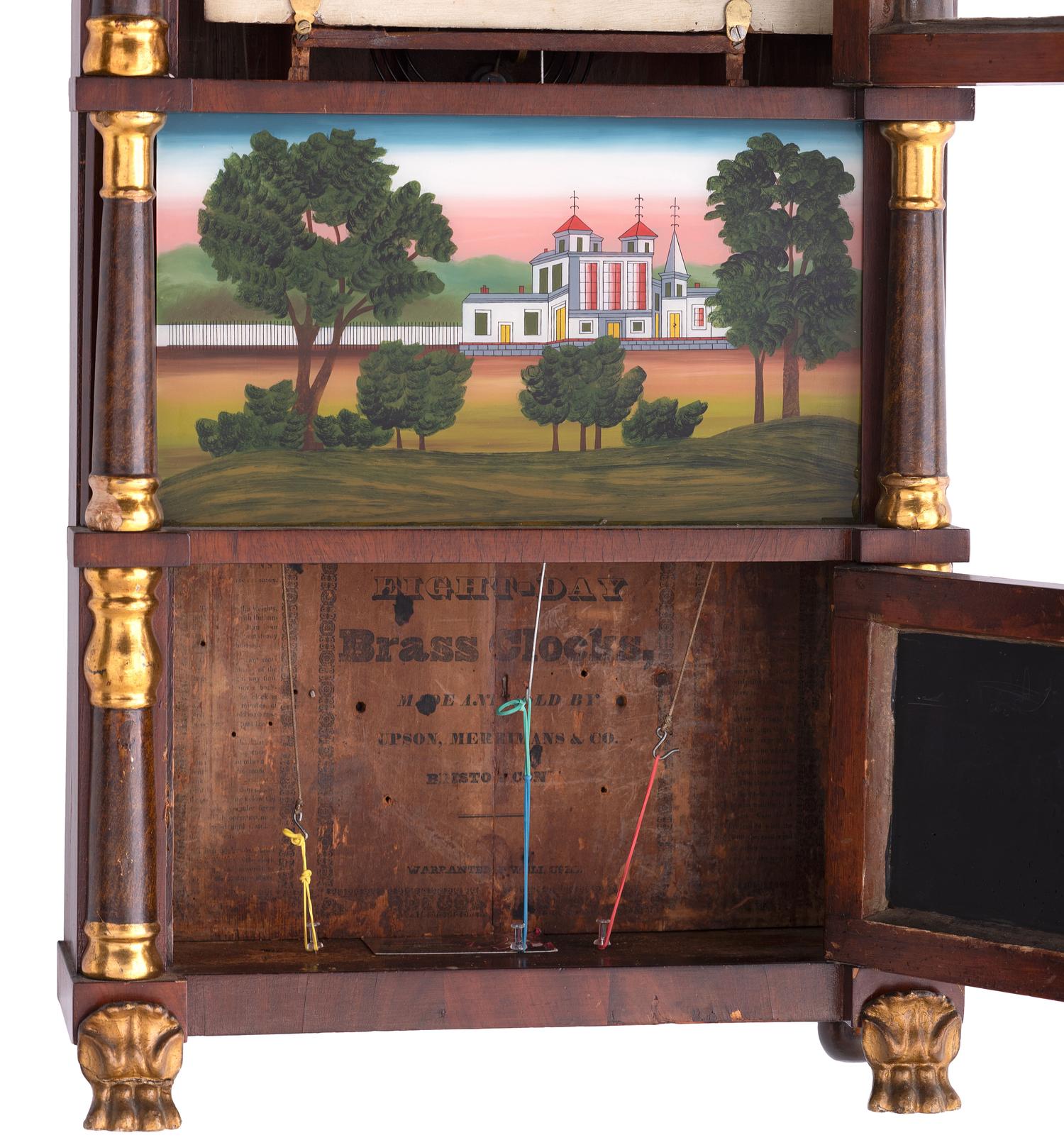 A Mahogany Eglomise and Parcel Gilt Mantel Clock
