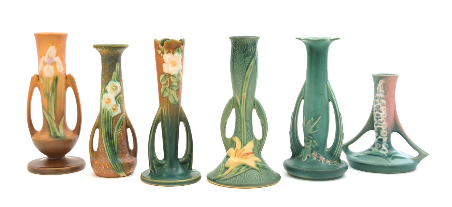 Six Roseville Pottery Bud Vases Height of tallest 7 1/2 inches.