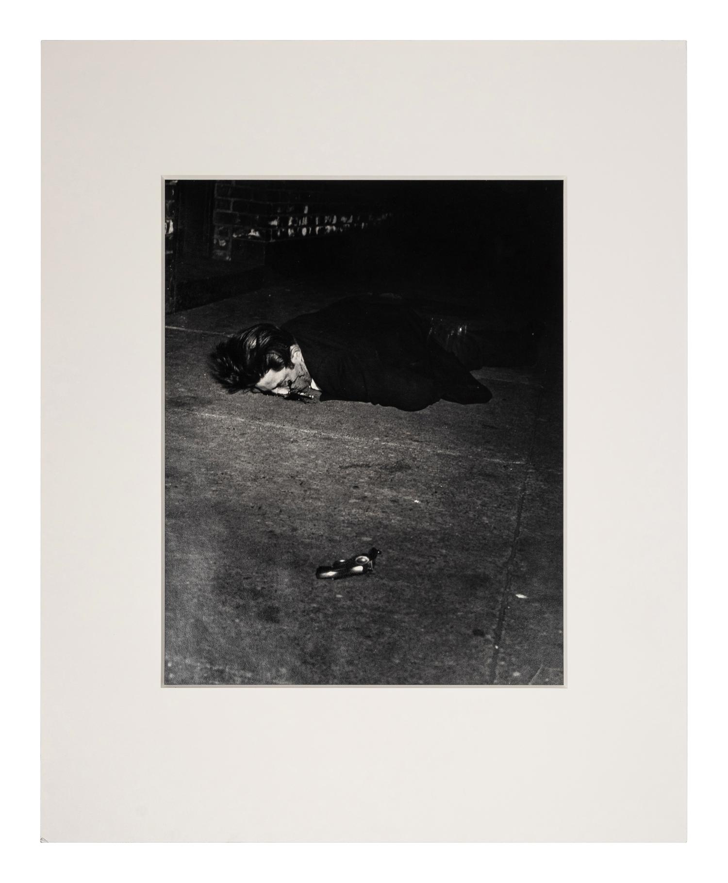 Weegee (1899-1968) Gunman killed by an off-duty cop, 344 Broome Street, February 3, 1942