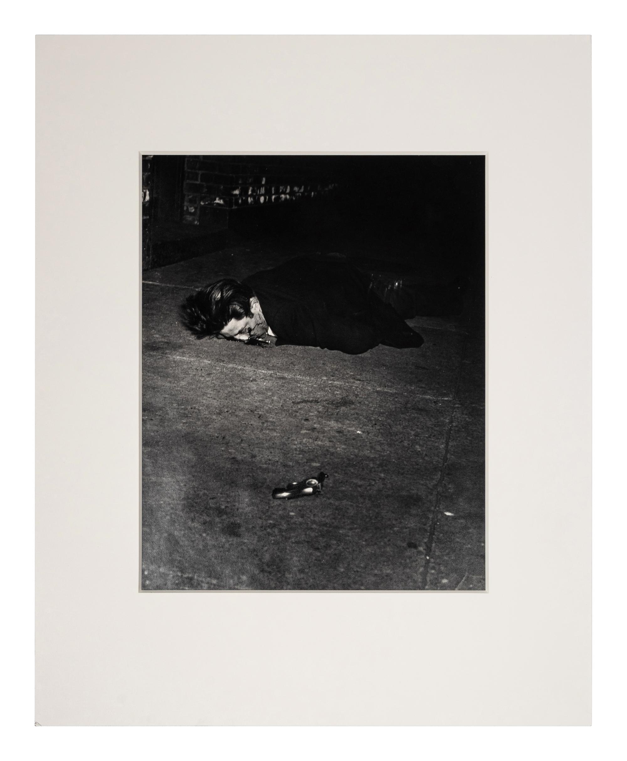 Weegee (1899-1968) Gunman killed by an off-duty cop, 344 Broome Street, February 3, 1942