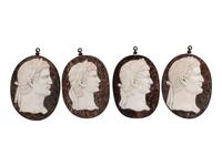 A Set of Four Italian Neoclassical Style Iron Mounted Marble Portrait Medallions