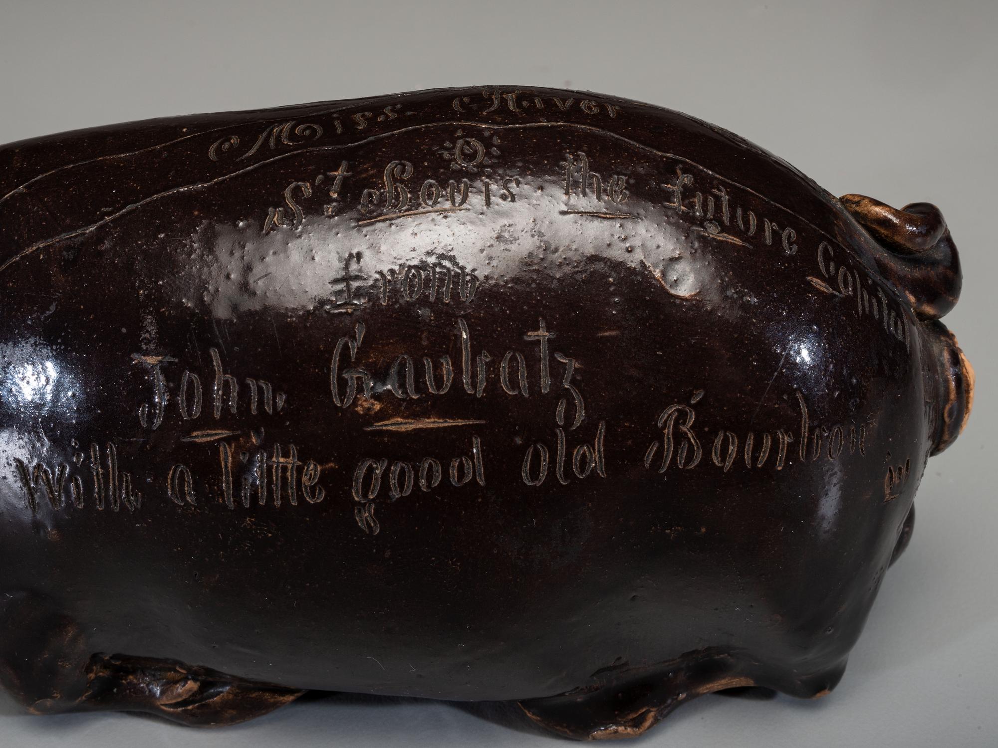 An Anna Pottery Incised and Brown Glazed Pig Flask
