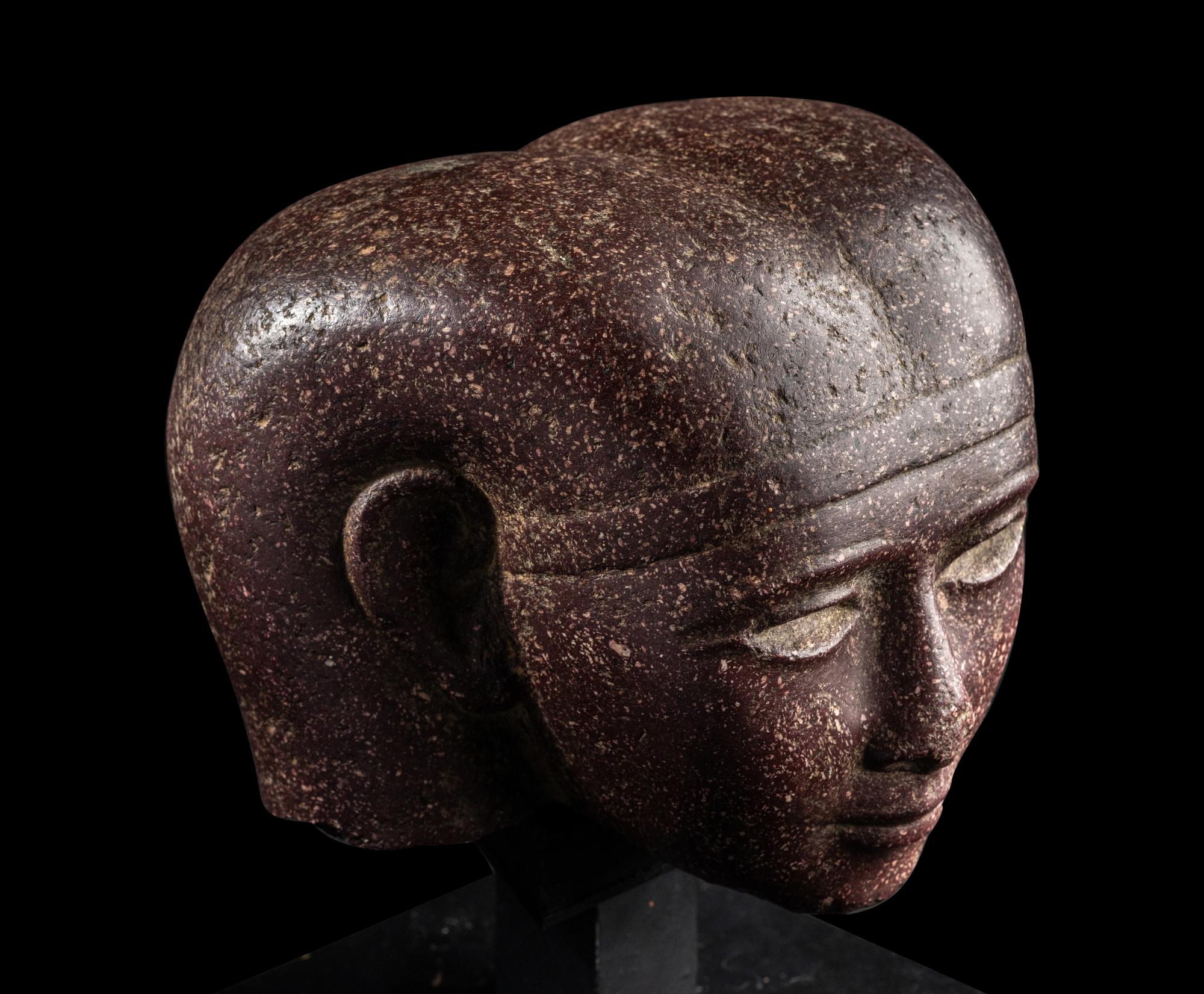 A Roman Porphyry Head of an Egyptian Woman