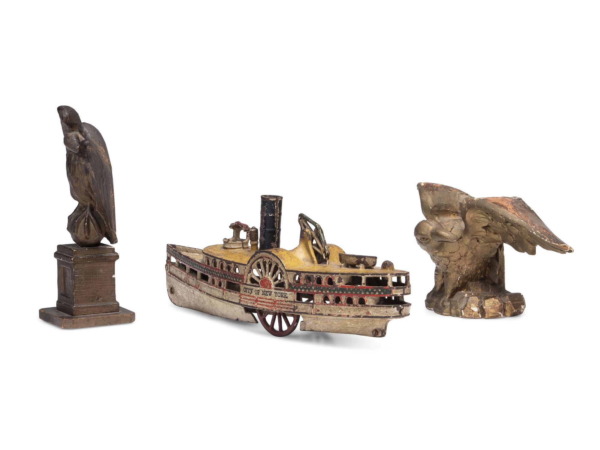 Two Carved and Painted Wood Eagle Finials, and a Cast Iron Paddleboat Boat Toy