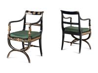 A Pair of Empire Style Ebonized and Parcel Gilt Curule Form Armchairs