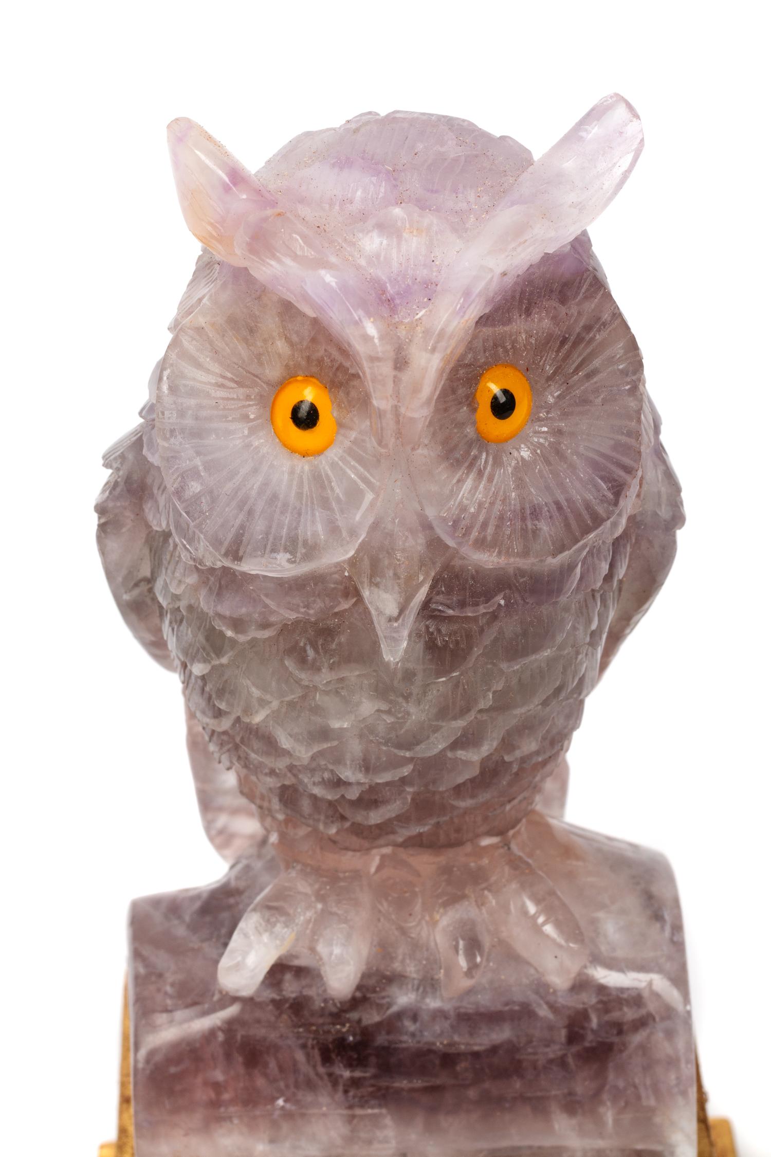 A Pair of Carved Amethyst Owls with Carved Wood Bases