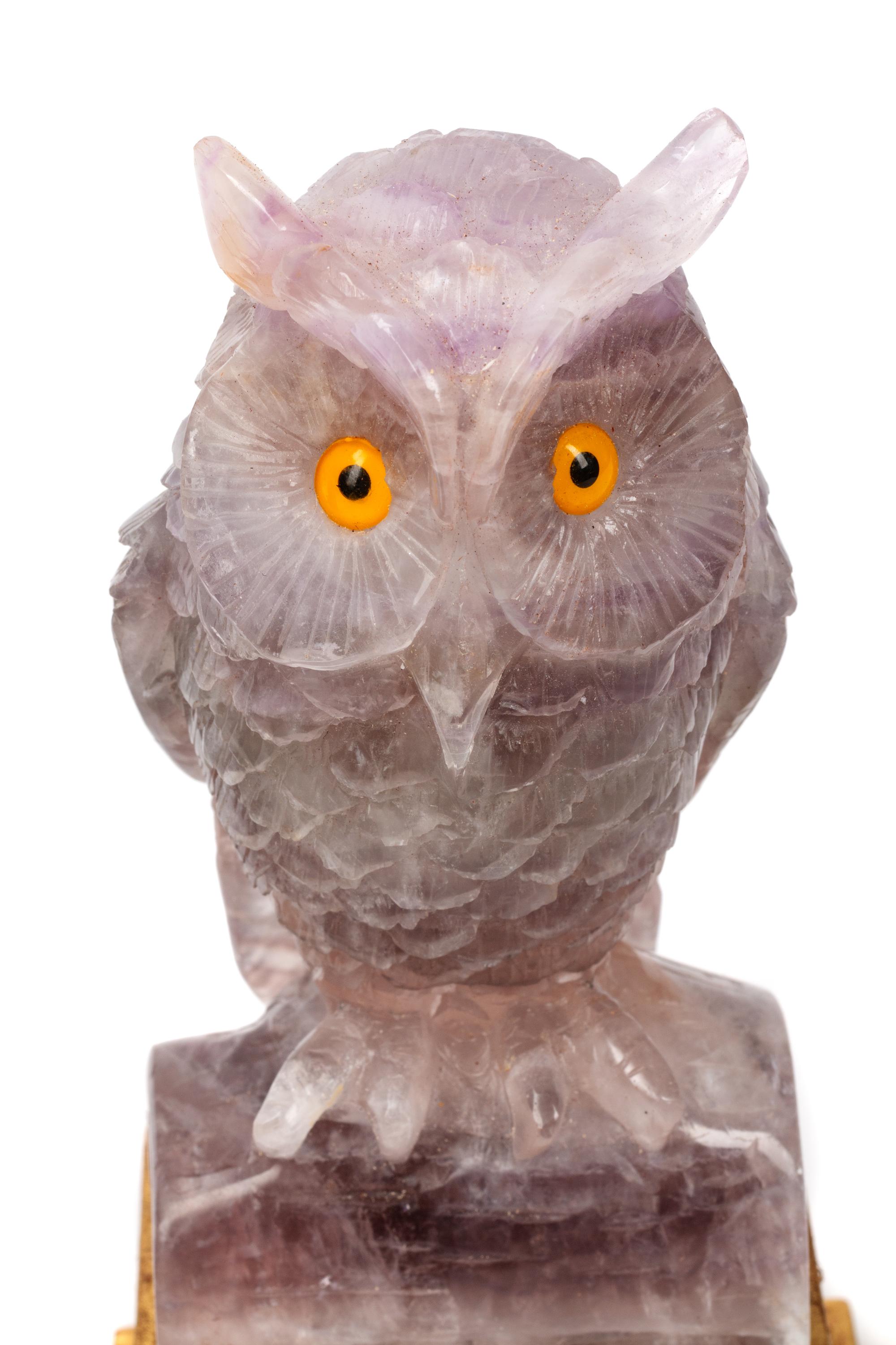 A Pair of Carved Amethyst Owls with Carved Wood Bases