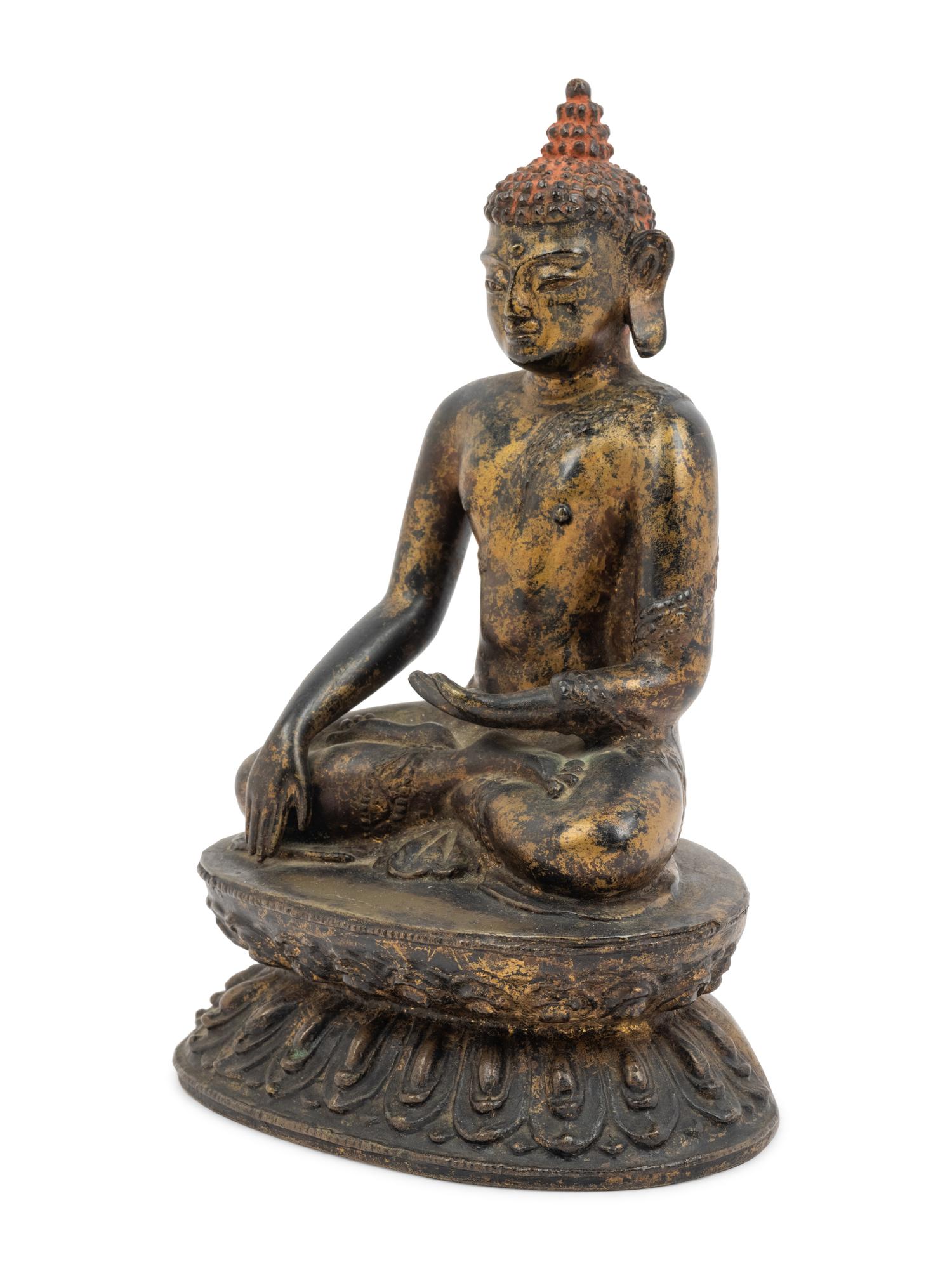 A Large Nepalese Gilt Bronze Figure of Seated Buddha
